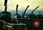 Image of VNAF helicopters on USS Midway during evacuation from Saigon South China Sea, 1975, second 18 stock footage video 65675069509