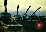 Image of VNAF helicopters on USS Midway during evacuation from Saigon South China Sea, 1975, second 19 stock footage video 65675069509