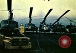 Image of VNAF helicopters on USS Midway during evacuation from Saigon South China Sea, 1975, second 21 stock footage video 65675069509