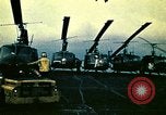 Image of VNAF helicopters on USS Midway during evacuation from Saigon South China Sea, 1975, second 22 stock footage video 65675069509