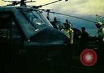 Image of VNAF helicopters on USS Midway during evacuation from Saigon South China Sea, 1975, second 23 stock footage video 65675069509
