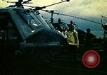 Image of VNAF helicopters on USS Midway during evacuation from Saigon South China Sea, 1975, second 24 stock footage video 65675069509