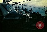 Image of VNAF helicopters on USS Midway during evacuation from Saigon South China Sea, 1975, second 27 stock footage video 65675069509
