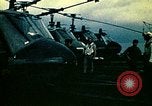 Image of VNAF helicopters on USS Midway during evacuation from Saigon South China Sea, 1975, second 28 stock footage video 65675069509