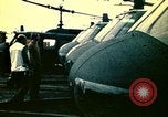 Image of VNAF helicopters on USS Midway during evacuation from Saigon South China Sea, 1975, second 30 stock footage video 65675069509