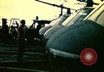 Image of VNAF helicopters on USS Midway during evacuation from Saigon South China Sea, 1975, second 35 stock footage video 65675069509