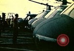 Image of VNAF helicopters on USS Midway during evacuation from Saigon South China Sea, 1975, second 36 stock footage video 65675069509