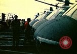 Image of VNAF helicopters on USS Midway during evacuation from Saigon South China Sea, 1975, second 39 stock footage video 65675069509