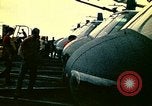 Image of VNAF helicopters on USS Midway during evacuation from Saigon South China Sea, 1975, second 40 stock footage video 65675069509
