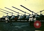 Image of VNAF helicopters on USS Midway during evacuation from Saigon South China Sea, 1975, second 42 stock footage video 65675069509