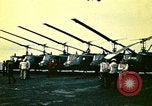 Image of VNAF helicopters on USS Midway during evacuation from Saigon South China Sea, 1975, second 44 stock footage video 65675069509