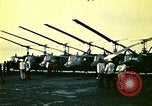 Image of VNAF helicopters on USS Midway during evacuation from Saigon South China Sea, 1975, second 45 stock footage video 65675069509