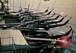Image of VNAF helicopters on USS Midway during evacuation from Saigon South China Sea, 1975, second 51 stock footage video 65675069509