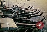 Image of VNAF helicopters on USS Midway during evacuation from Saigon South China Sea, 1975, second 52 stock footage video 65675069509