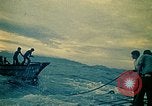 Image of Vietnamese evacuees board US Navy ship South China Sea, 1975, second 14 stock footage video 65675069510