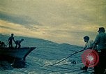 Image of Vietnamese evacuees board US Navy ship South China Sea, 1975, second 15 stock footage video 65675069510