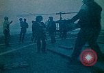 Image of helicopters thrown overboard during fall of Saigon South China Sea, 1975, second 1 stock footage video 65675069511