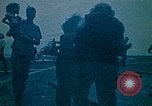 Image of helicopters thrown overboard during fall of Saigon South China Sea, 1975, second 3 stock footage video 65675069511