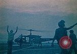 Image of helicopters thrown overboard during fall of Saigon South China Sea, 1975, second 5 stock footage video 65675069511