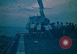 Image of helicopters thrown overboard during fall of Saigon South China Sea, 1975, second 11 stock footage video 65675069511