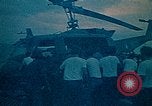 Image of helicopters thrown overboard during fall of Saigon South China Sea, 1975, second 18 stock footage video 65675069511