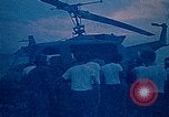 Image of helicopters thrown overboard during fall of Saigon South China Sea, 1975, second 19 stock footage video 65675069511