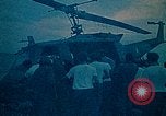 Image of helicopters thrown overboard during fall of Saigon South China Sea, 1975, second 20 stock footage video 65675069511
