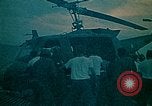 Image of helicopters thrown overboard during fall of Saigon South China Sea, 1975, second 21 stock footage video 65675069511
