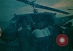 Image of helicopters thrown overboard during fall of Saigon South China Sea, 1975, second 23 stock footage video 65675069511