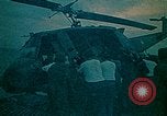 Image of helicopters thrown overboard during fall of Saigon South China Sea, 1975, second 24 stock footage video 65675069511