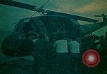 Image of helicopters thrown overboard during fall of Saigon South China Sea, 1975, second 25 stock footage video 65675069511