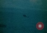 Image of helicopters thrown overboard during fall of Saigon South China Sea, 1975, second 35 stock footage video 65675069511