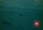 Image of helicopters thrown overboard during fall of Saigon South China Sea, 1975, second 37 stock footage video 65675069511