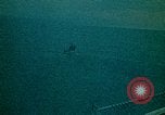 Image of helicopters thrown overboard during fall of Saigon South China Sea, 1975, second 40 stock footage video 65675069511