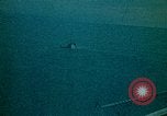 Image of helicopters thrown overboard during fall of Saigon South China Sea, 1975, second 41 stock footage video 65675069511