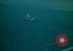 Image of helicopters thrown overboard during fall of Saigon South China Sea, 1975, second 42 stock footage video 65675069511