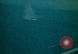 Image of helicopters thrown overboard during fall of Saigon South China Sea, 1975, second 43 stock footage video 65675069511