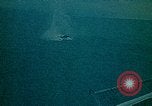 Image of helicopters thrown overboard during fall of Saigon South China Sea, 1975, second 44 stock footage video 65675069511