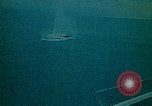 Image of helicopters thrown overboard during fall of Saigon South China Sea, 1975, second 45 stock footage video 65675069511