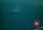 Image of helicopters thrown overboard during fall of Saigon South China Sea, 1975, second 46 stock footage video 65675069511