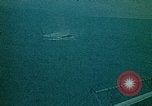 Image of helicopters thrown overboard during fall of Saigon South China Sea, 1975, second 47 stock footage video 65675069511