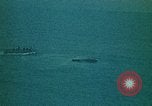 Image of helicopters thrown overboard during fall of Saigon South China Sea, 1975, second 49 stock footage video 65675069511