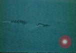 Image of helicopters thrown overboard during fall of Saigon South China Sea, 1975, second 51 stock footage video 65675069511