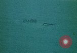 Image of helicopters thrown overboard during fall of Saigon South China Sea, 1975, second 56 stock footage video 65675069511