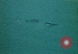 Image of helicopters thrown overboard during fall of Saigon South China Sea, 1975, second 57 stock footage video 65675069511
