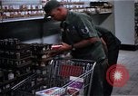 Image of Personnel buy food items Saigon Vietnam, 1965, second 6 stock footage video 65675069607