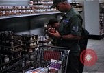Image of Personnel buy food items Saigon Vietnam, 1965, second 7 stock footage video 65675069607