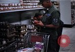 Image of Personnel buy food items Saigon Vietnam, 1965, second 8 stock footage video 65675069607