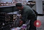 Image of Personnel buy food items Saigon Vietnam, 1965, second 10 stock footage video 65675069607