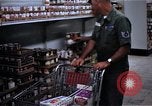 Image of Personnel buy food items Saigon Vietnam, 1965, second 11 stock footage video 65675069607